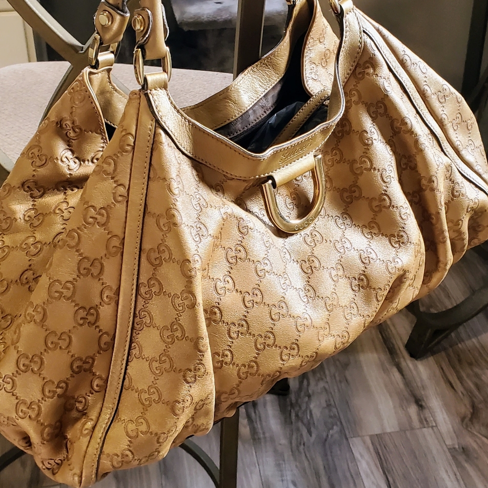 GUCCI Abbey D-ring leather GG embossed hobo